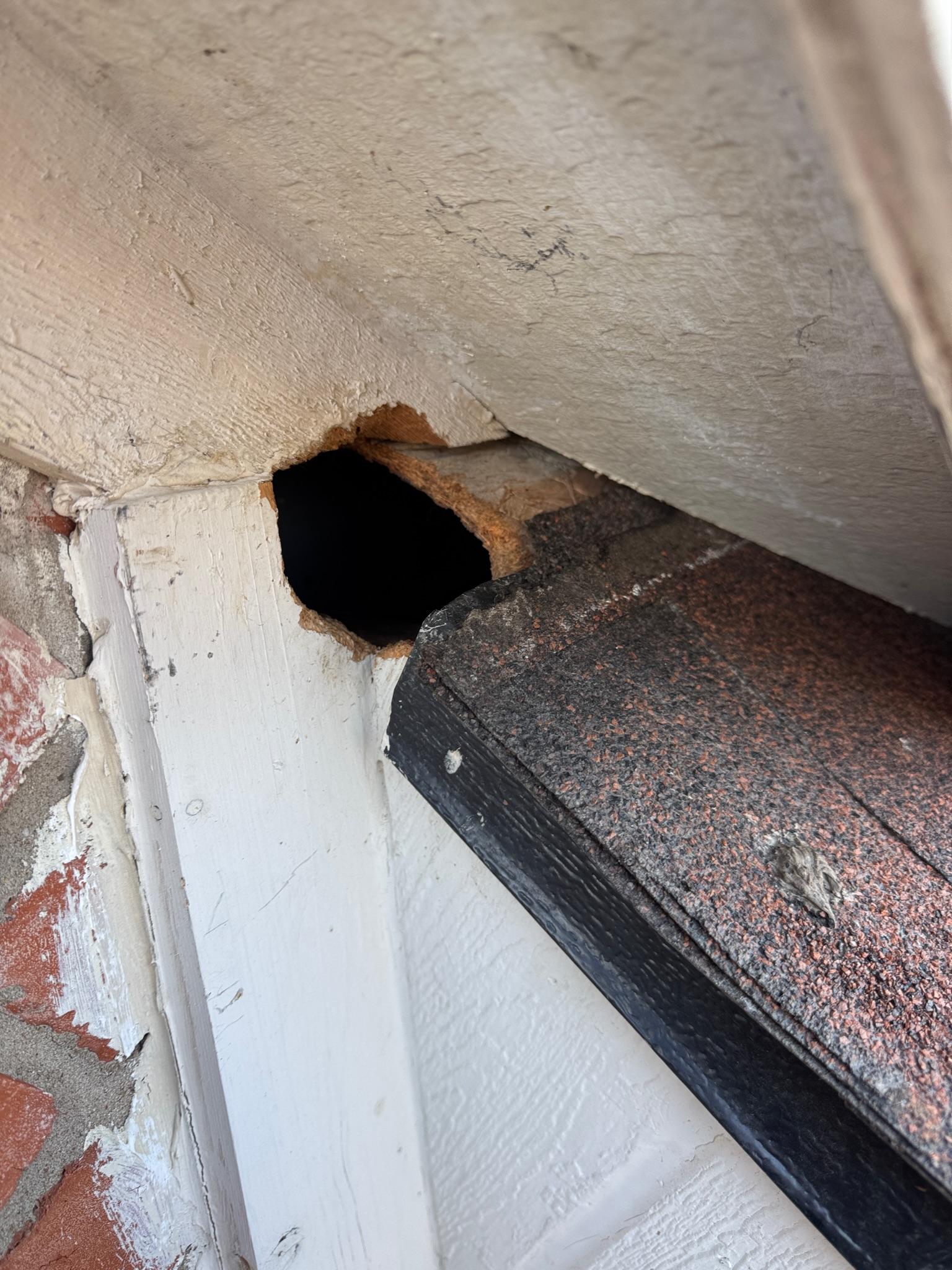 Open corner between exterior trim and a shingle roof