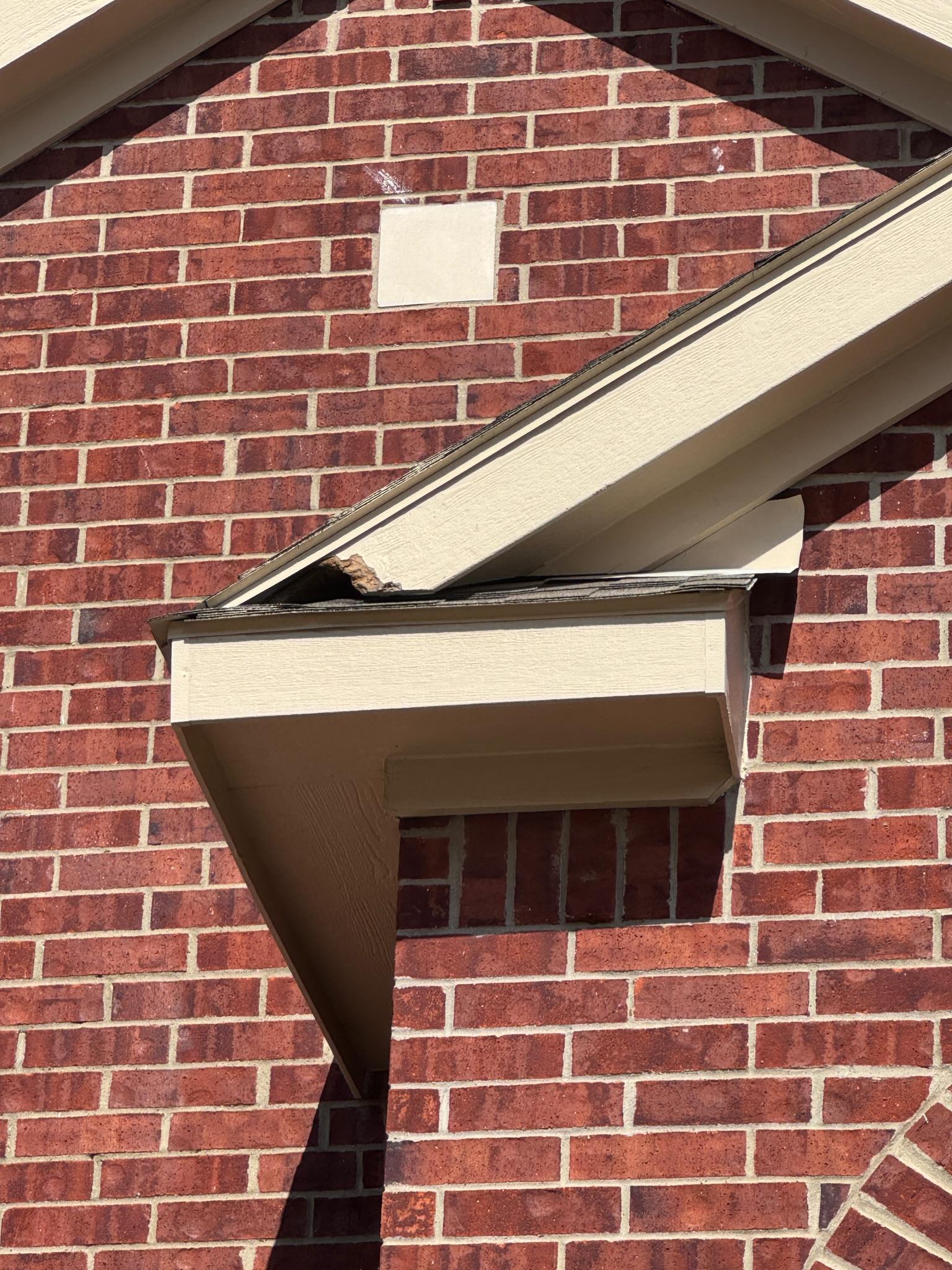 Roof and soffit junction on the exterior of a brick house